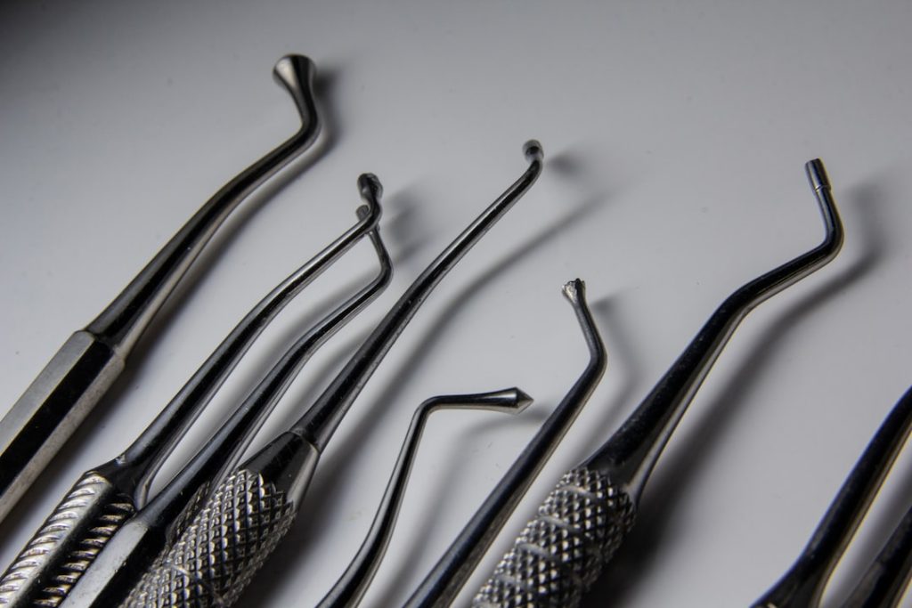 a group of dental tools sitting on top of a table
